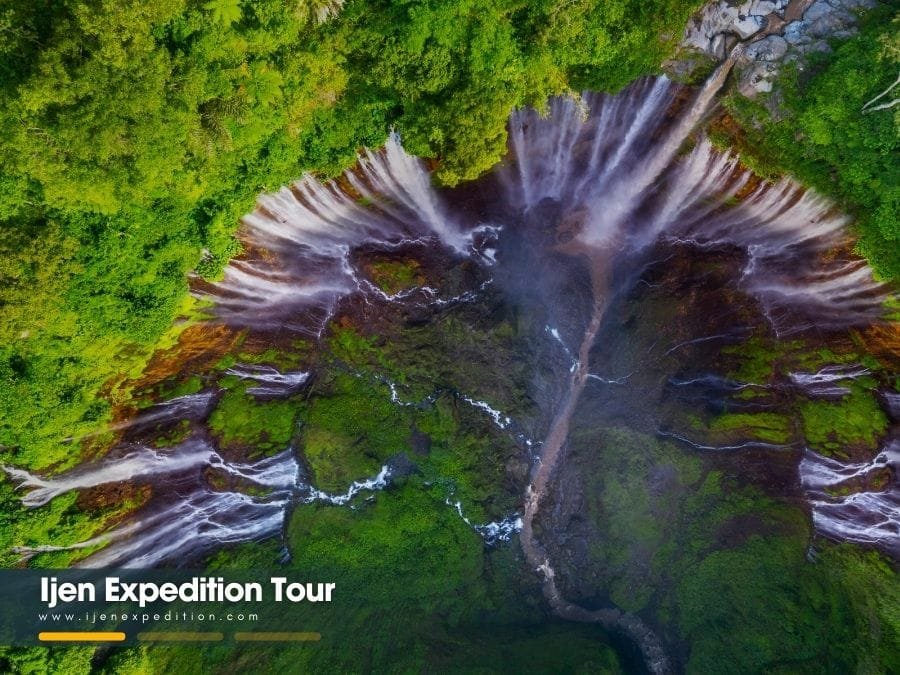 Panoramic aerial view of Tumpak Sewu Waterfall in East Java showing the thousand falls curtain effect