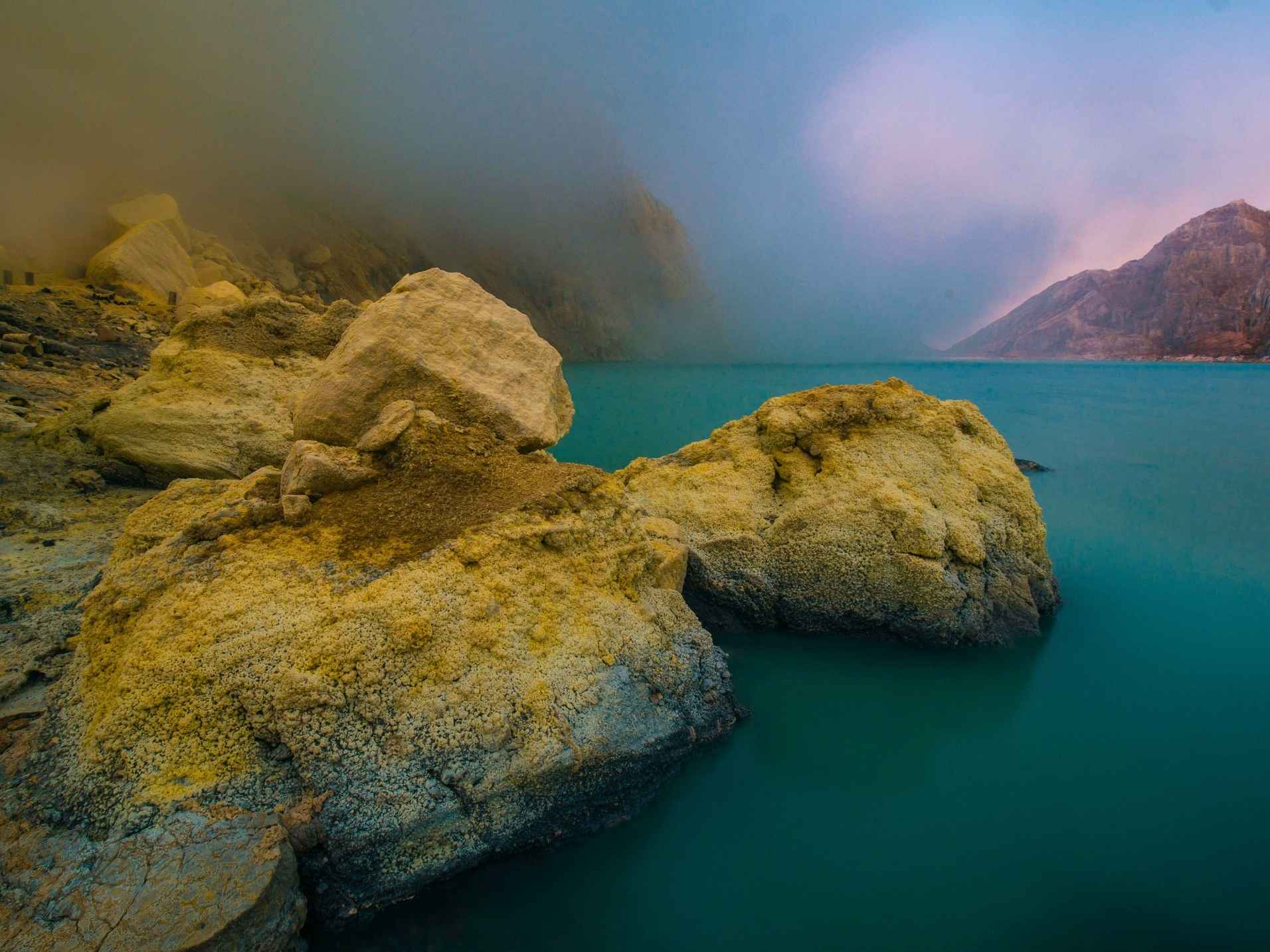 Turquoise acidic crater lake at Ijen Volcano in East Java