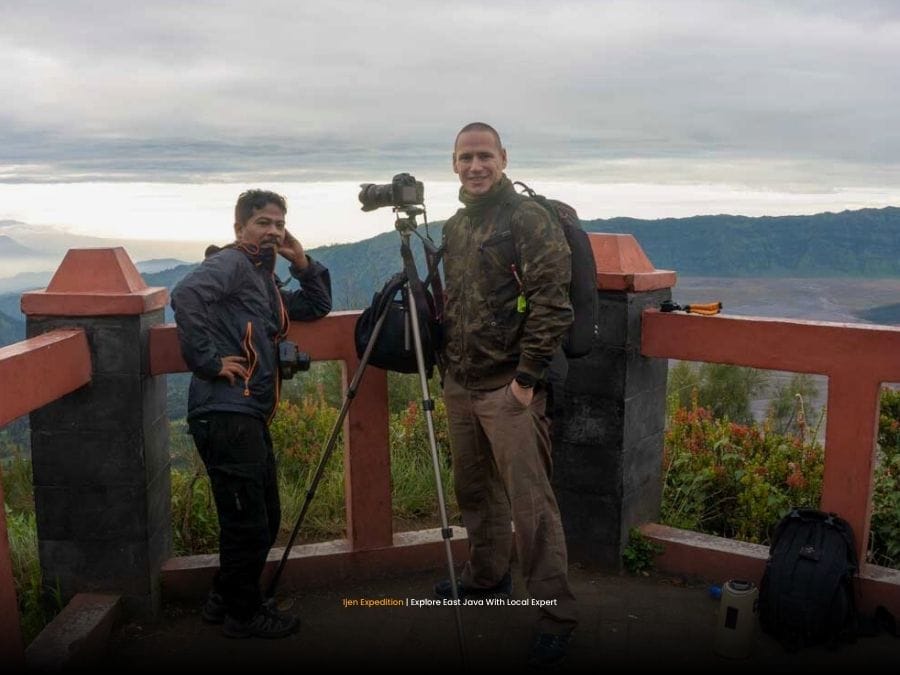 Local guide explaining volcano route in East Java