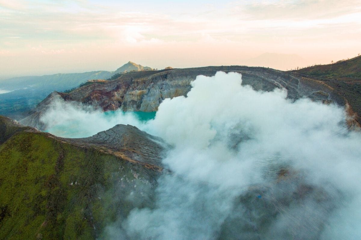 sunrise view over turquoise lake at Ijen volcano