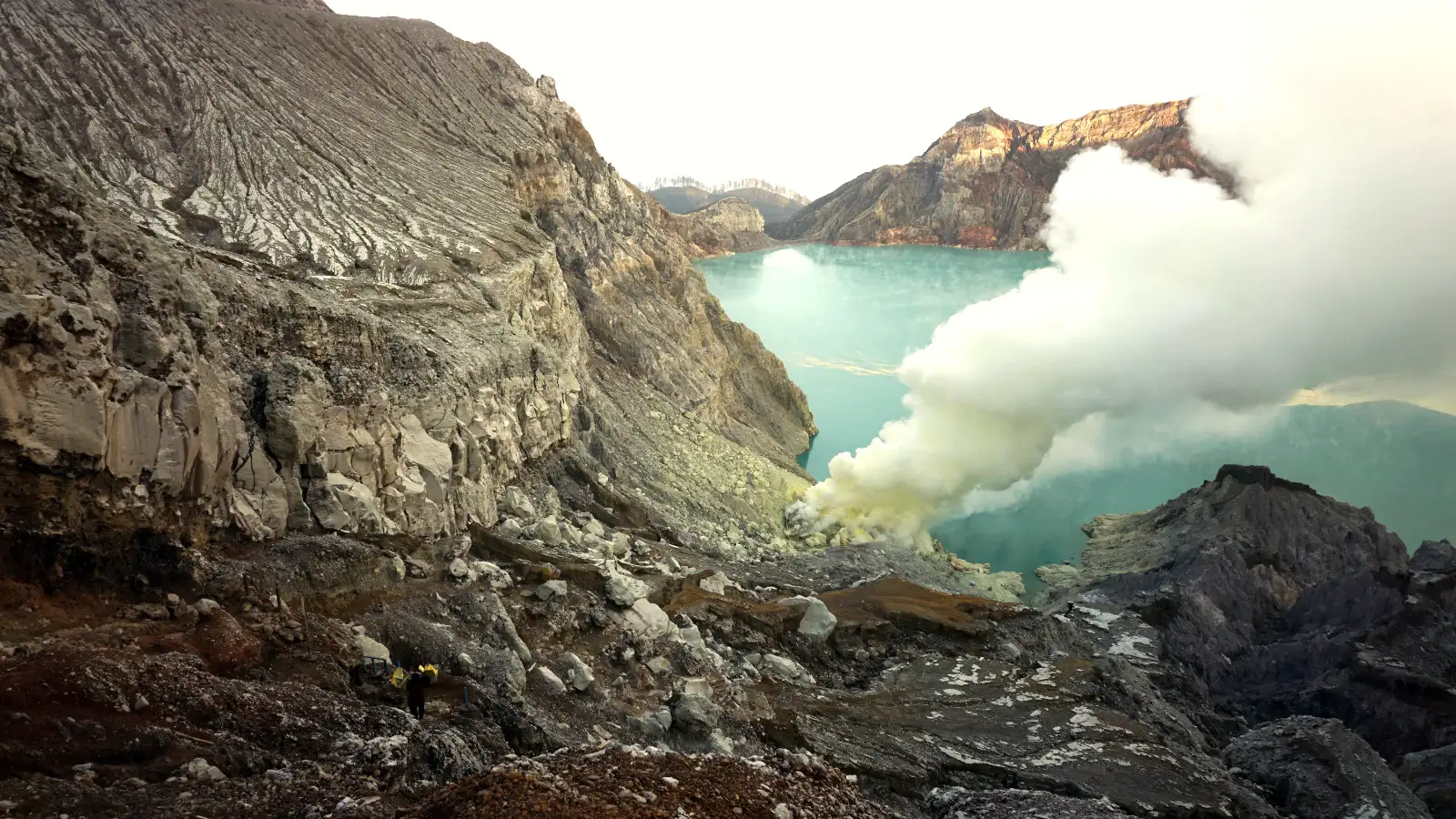 The Hardworking Sulfur Miners of Kawah Ijen Local sulfur miner carrying heavy baskets of yellow sulfur out of the Ijen crater