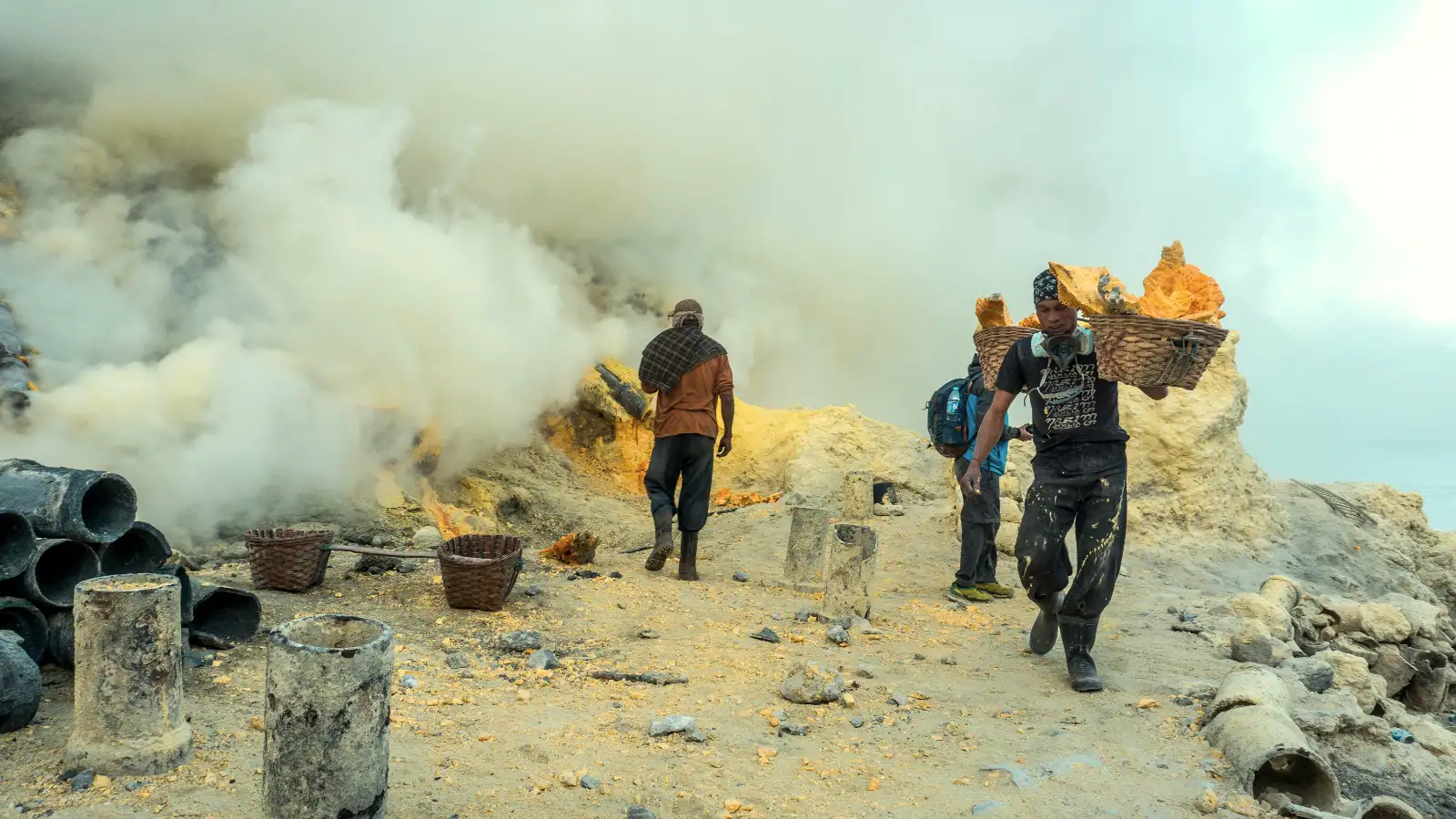 Sulfur miner working amidst the thick toxic clouds of the Ijen volcanic vent