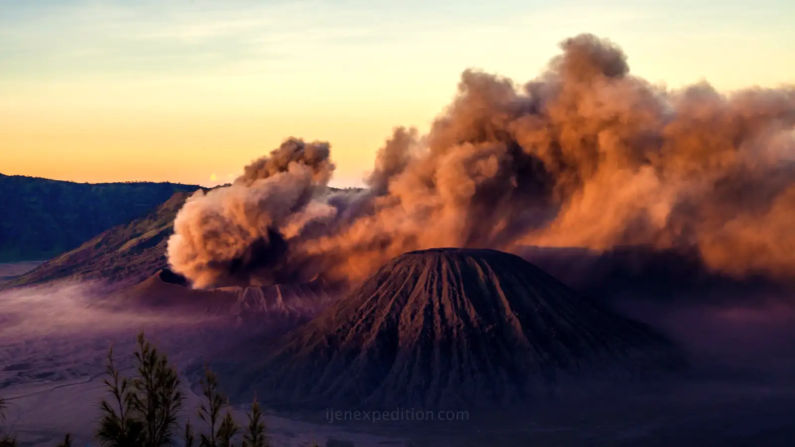 The famous blue flames of Ijen Crater glowing in the dark during a midnight trek
