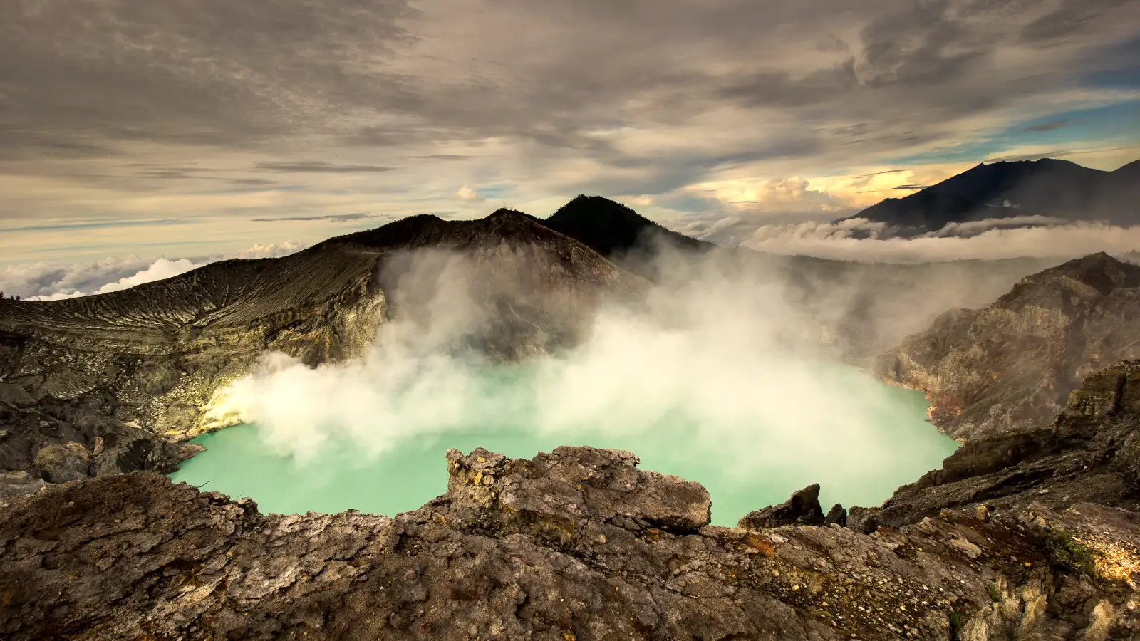 Ijen Crater Sunrise View Sunrise over Ijen Crater with teal and orange hues