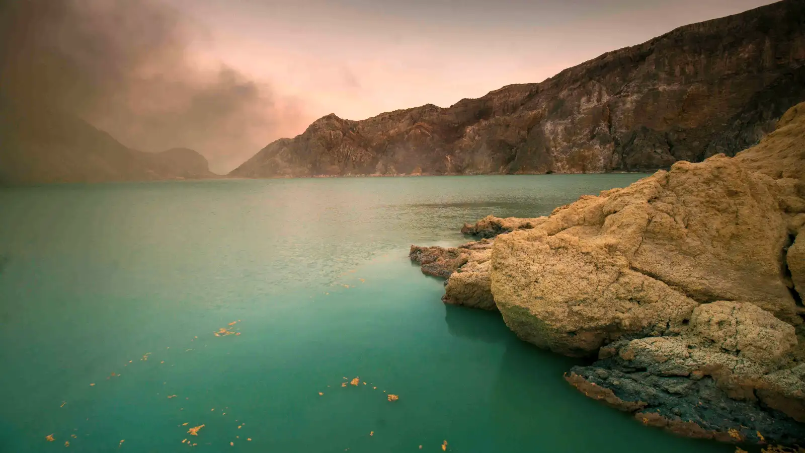Stunning turquoise acid lake of Kawah Ijen crater in East Java