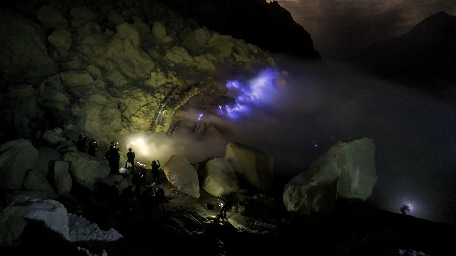 Misty volcanic ridges of the Ijen plateau stretching into the distance at dawn