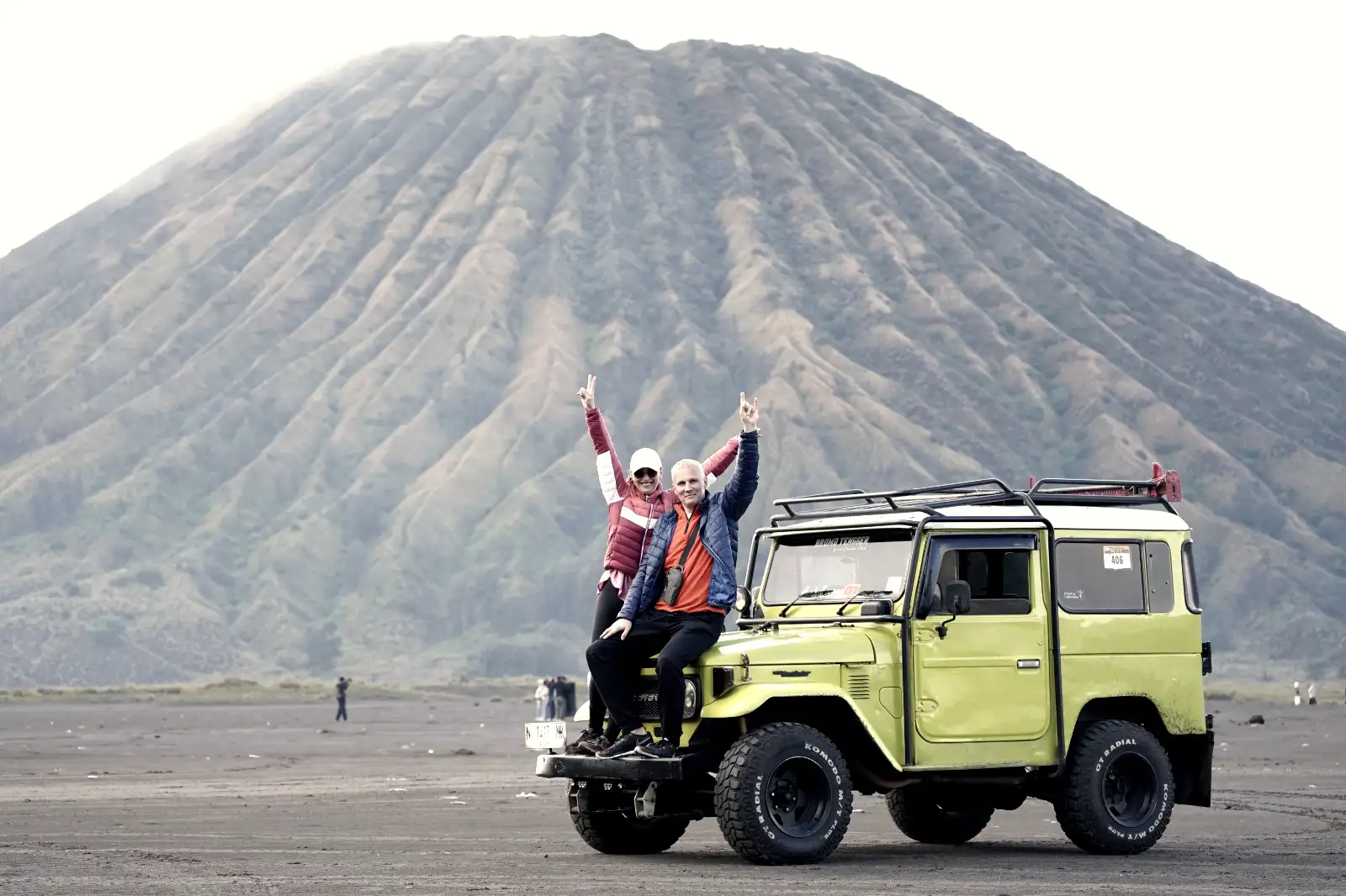 Family exploring the volcanic landscape of Ijen Crater at sunrise