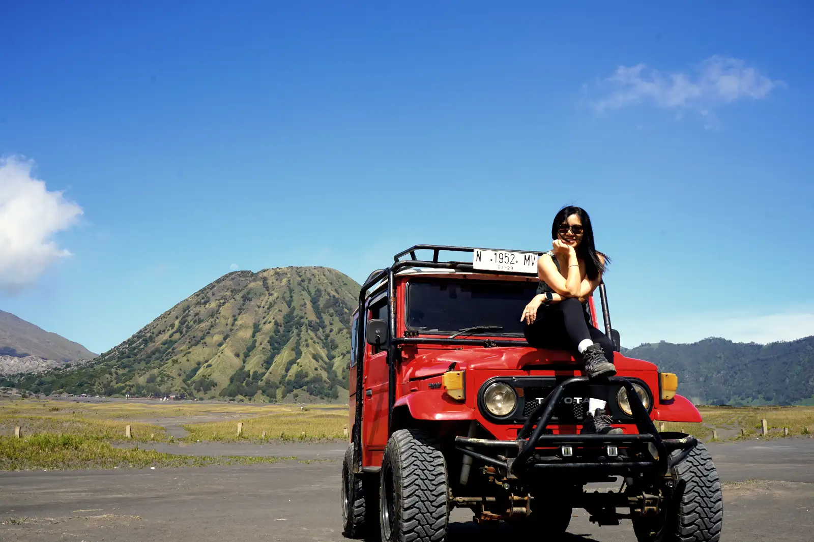 Mount Bromo sunrise view with volcanic smoke