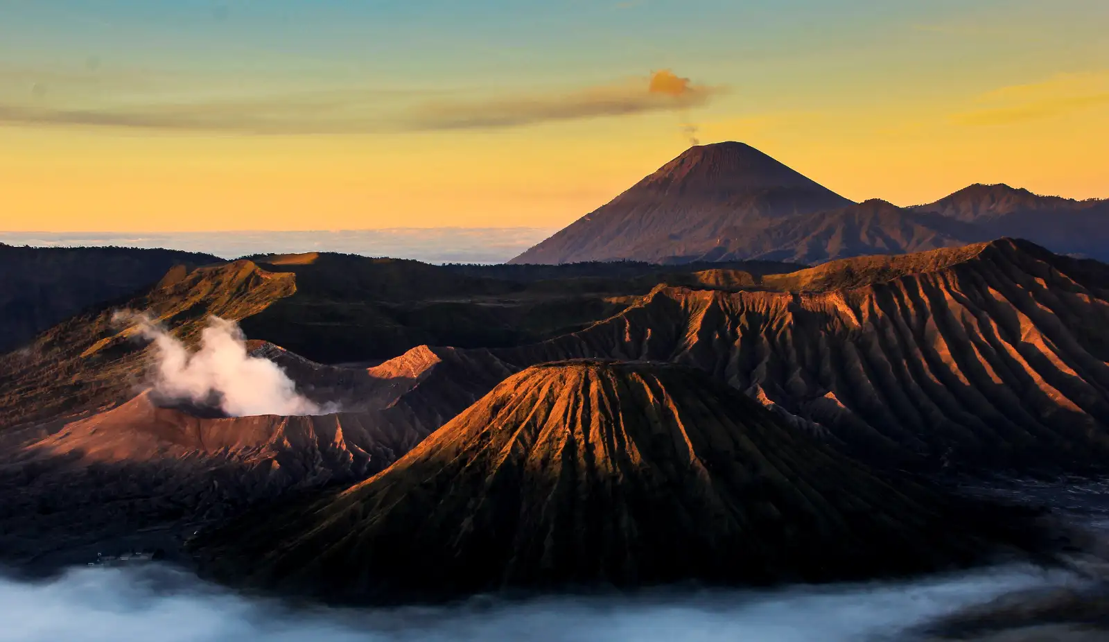 Stunning sunrise view of Mount Bromo and Ijen Crater volcanic landscapes in East Java