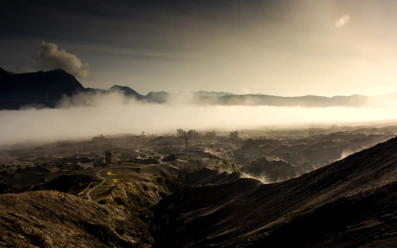 Stunning Mount Bromo Sunrise Scene Sunrise view at Bromo Tengger Semeru National Park with volcanic peaks and thick morning fog