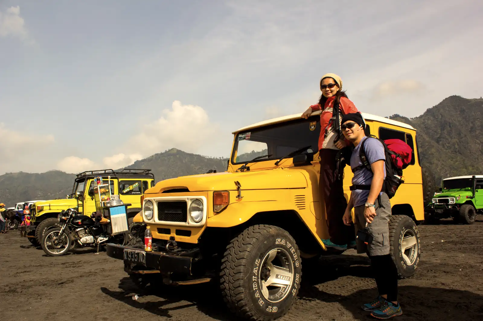 Travelers hiking on the rim of a volcano in Java