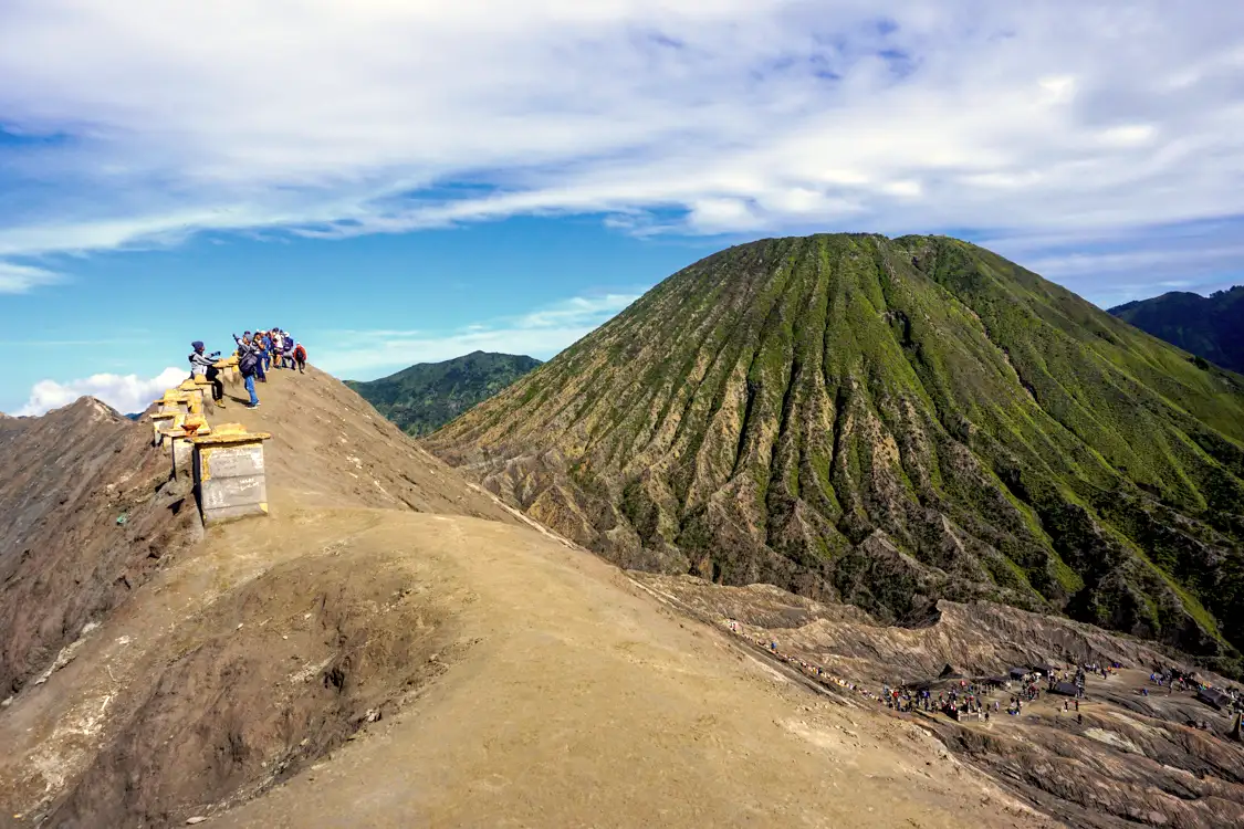 Golden Hour at the Bromo Tengger Semeru Massif A breathtaking sunrise trek overview showing the Bromo Tengger Semeru National Park peaks during dawn