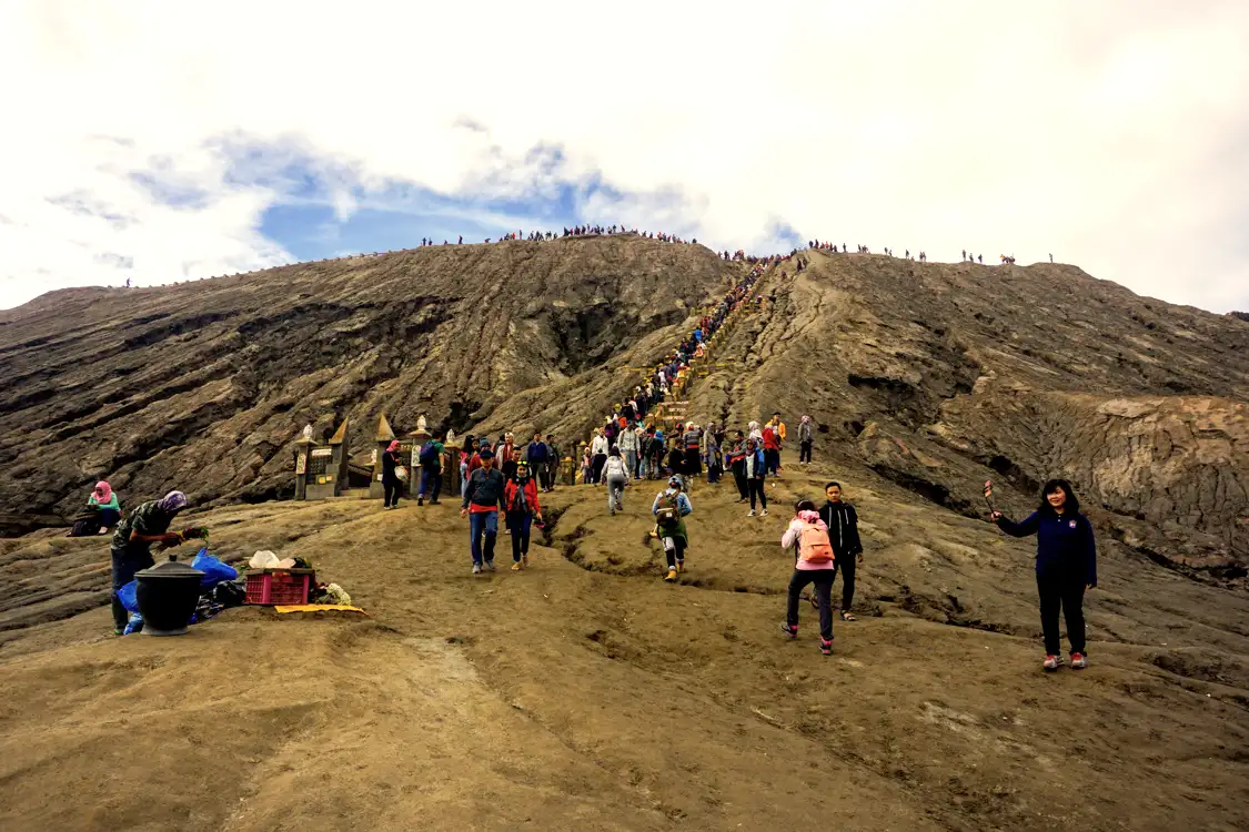 Hikers ascending the concrete stairs of Mount Bromo in East Java